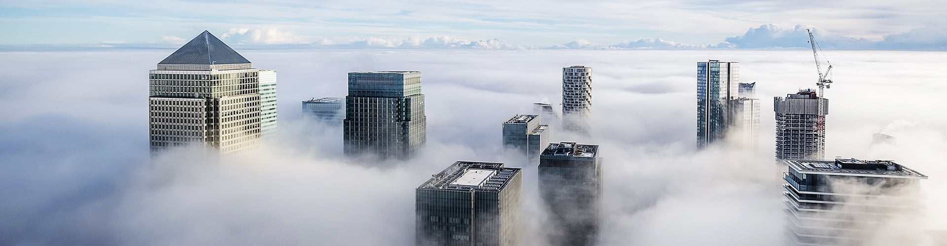 City skyscrapers visible through clouds
